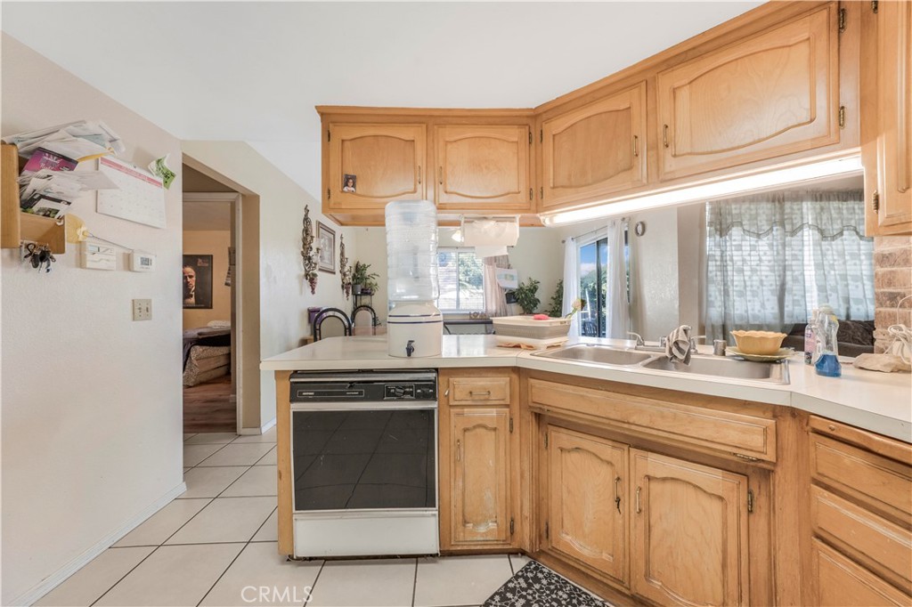 240 North 4th Street Shandon, CA 93461 - Photo 15 of 38 a kitchen with a sink stove and cabinets