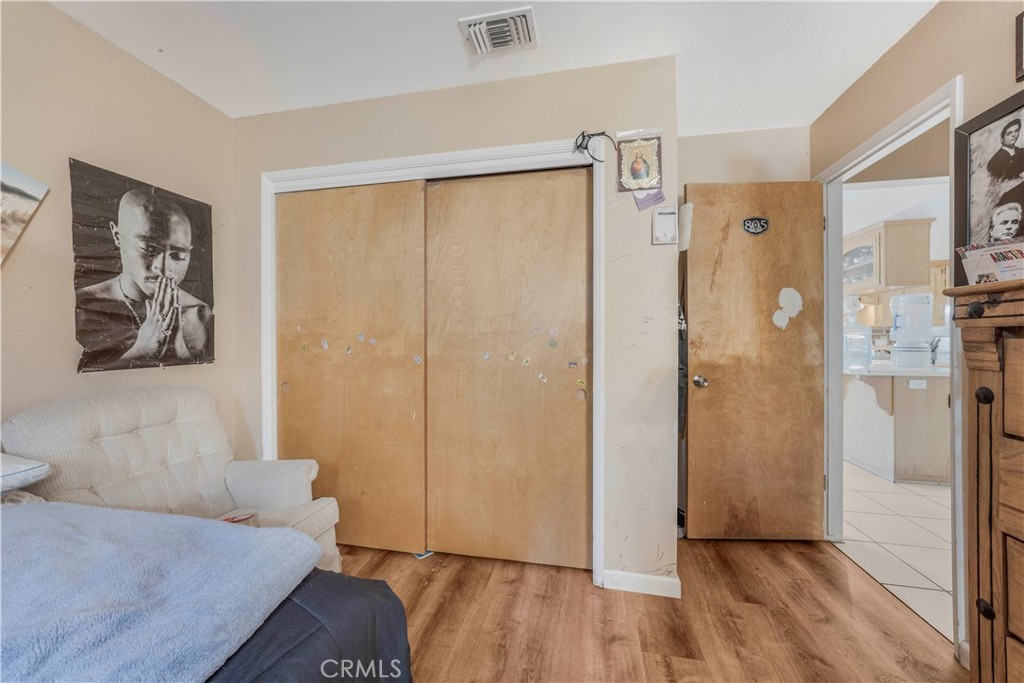 240 North 4th Street Shandon, CA 93461 - Photo 19 of 38 a view of a hallway with wooden floor and closet