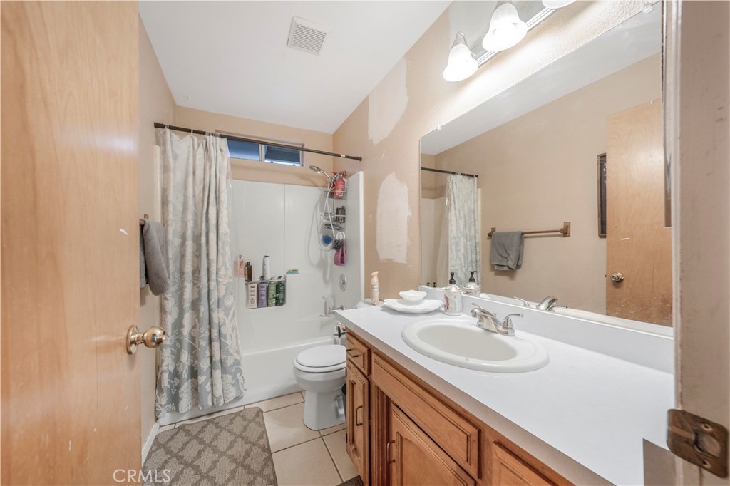 240 North 4th Street Shandon, CA 93461 - Photo 23 of 38 a bathroom with a sink toilet and shower