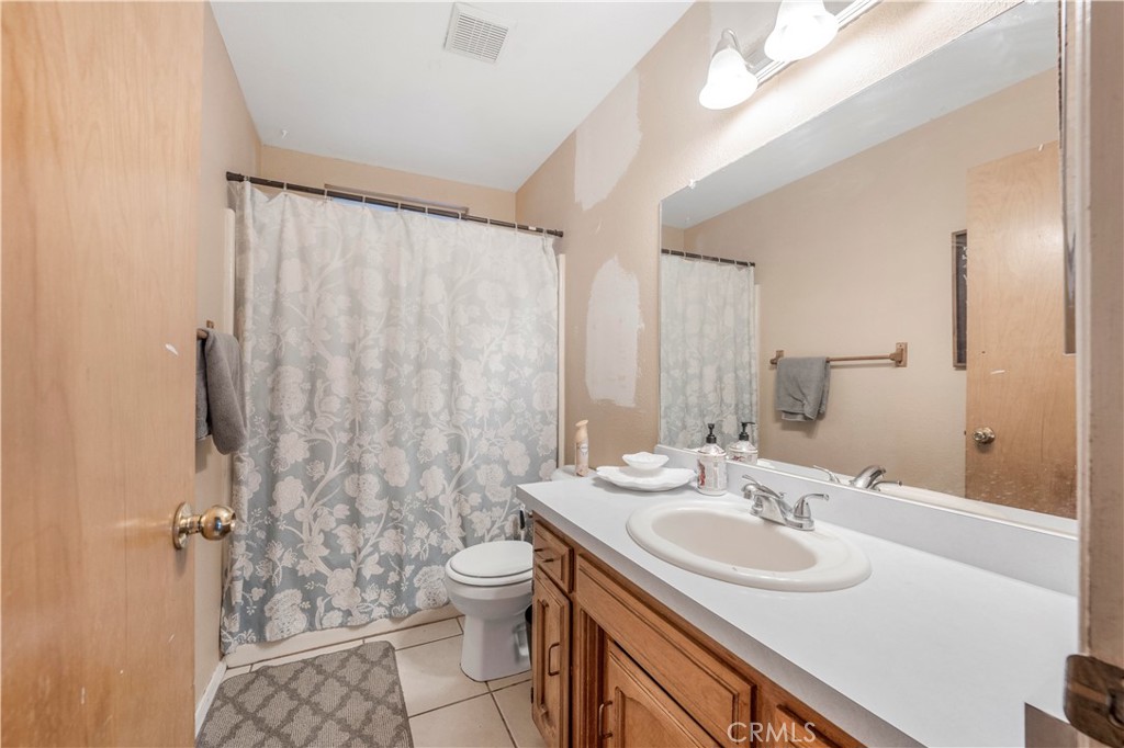 240 North 4th Street Shandon, CA 93461 - Photo 24 of 38 a bathroom with a sink toilet and shower