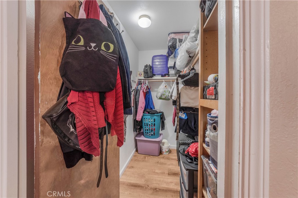 240 North 4th Street Shandon, CA 93461 - Photo 27 of 38 a view of walk in closet with clothes
