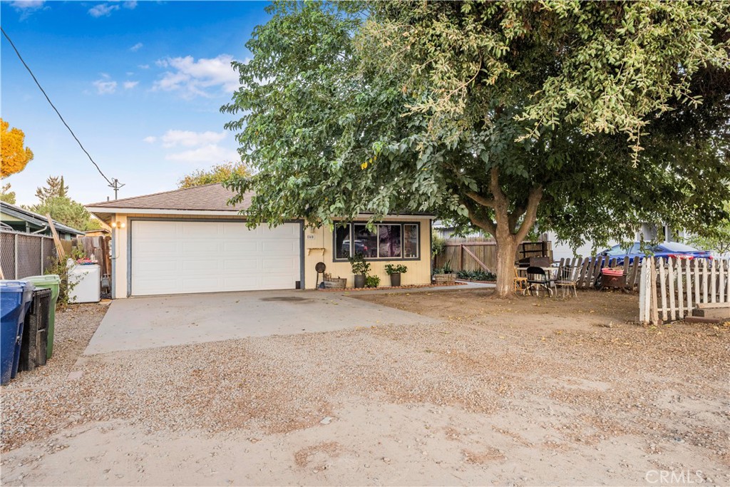 240 North 4th Street Shandon, CA 93461 - Photo 4 of 38 a view of a house with a yard and garage