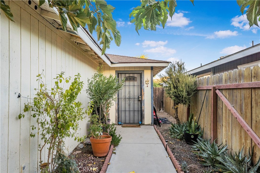 240 North 4th Street Shandon, CA 93461 - Photo 7 of 38 a front view of a house with a lots of potted plants