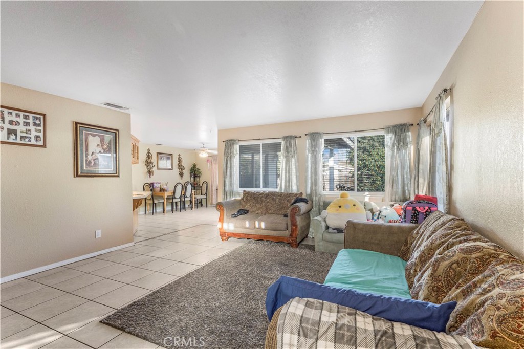 240 North 4th Street Shandon, CA 93461 - Photo 9 of 38 a living room with furniture and a large window