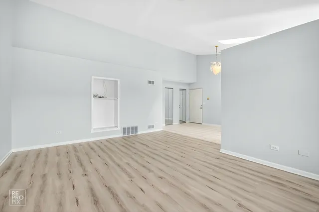 a kitchen with a stove a sink and a microwave