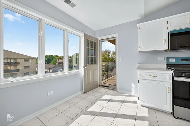 a view of a balcony with furniture