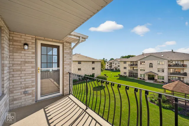 a kitchen with a stove and a clock