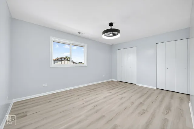 a space with wooden floor and a window