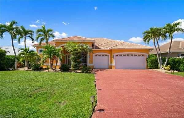 a front view of house with yard and green space