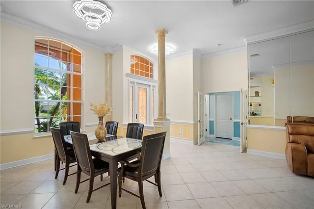 a view of a dining room with furniture and a window