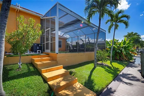 a view of swimming pool with outdoor seating