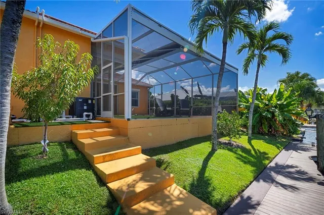 a view of swimming pool with outdoor seating