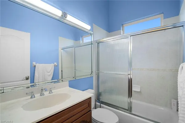 a bedroom with a bed and a closet