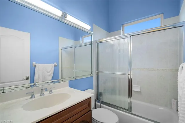 a bedroom with a bed and a closet