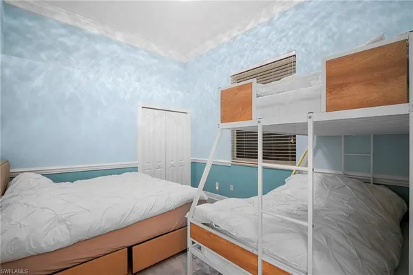 a bathroom with a shower sink vanity mirror and toilet