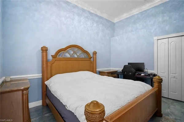 a bedroom with a bed and cabinets