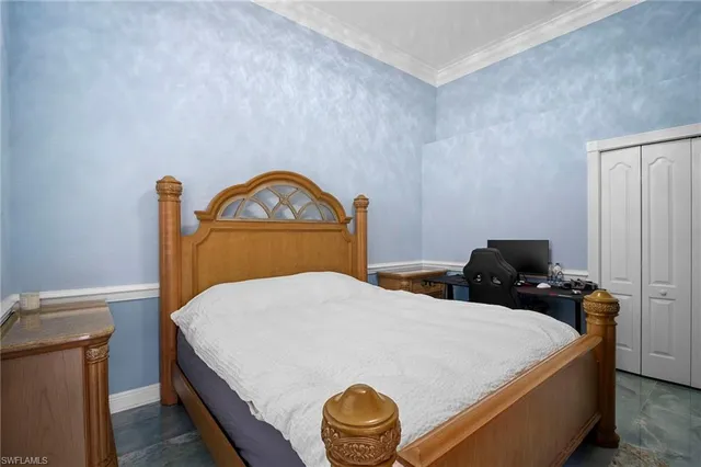 a bedroom with a bed and cabinets