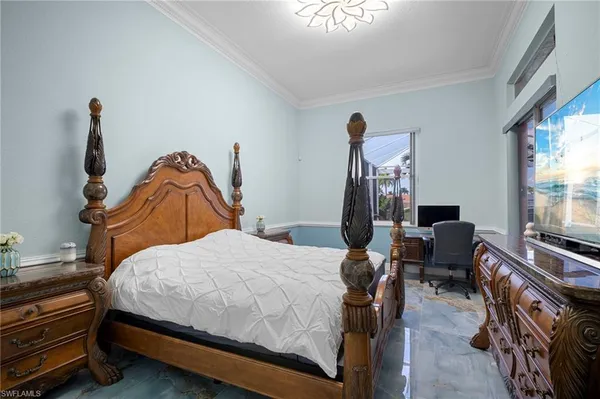 a view of a room that has a bed and a window