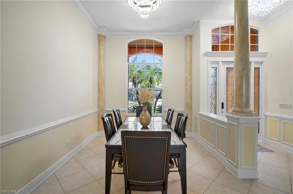 a dining room with furniture and window