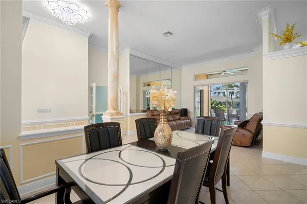 a dining room with furniture and window