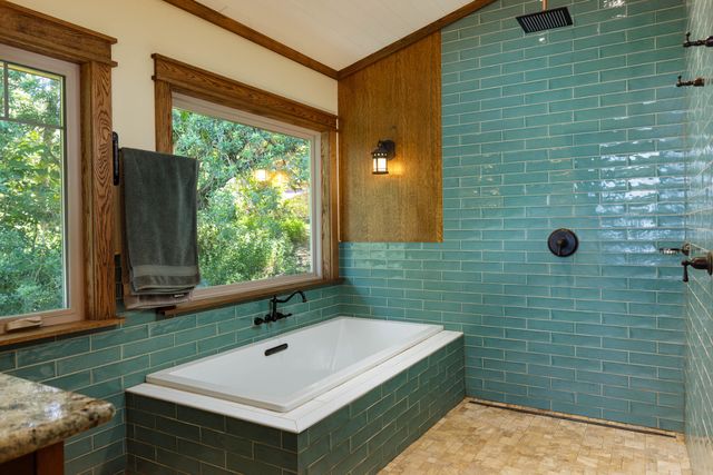 a bathroom with a sink and a large window
