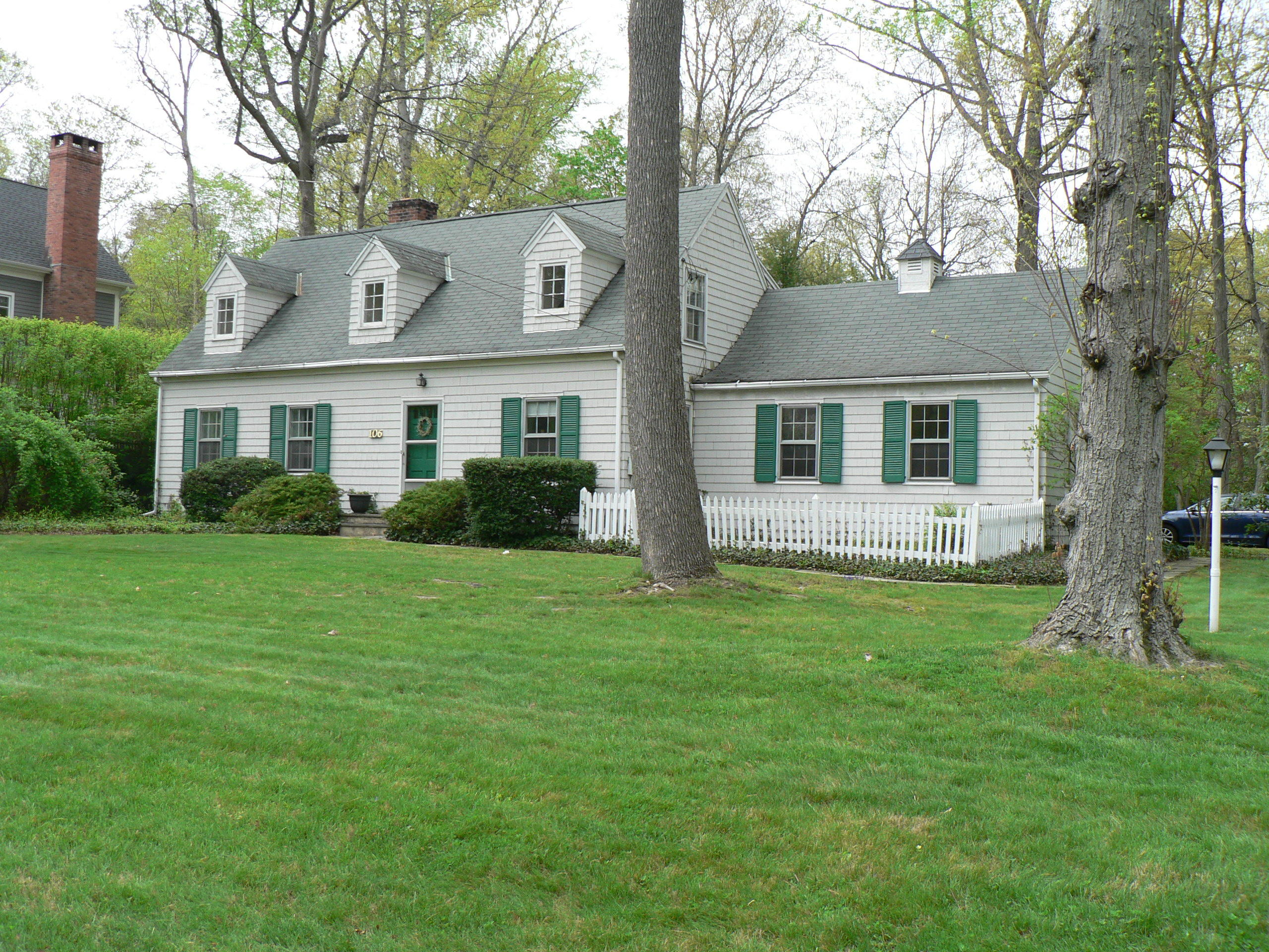 106 Woodland Road New Canaan, CT 06840 - Photo 2 of 10 a view of a house with a garden