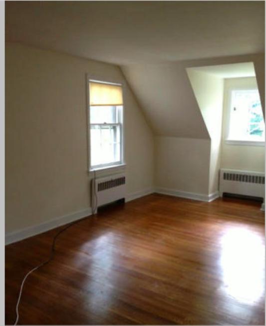 106 Woodland Road New Canaan, CT 06840 - Photo 3 of 10 a view of a room with wooden floor and window