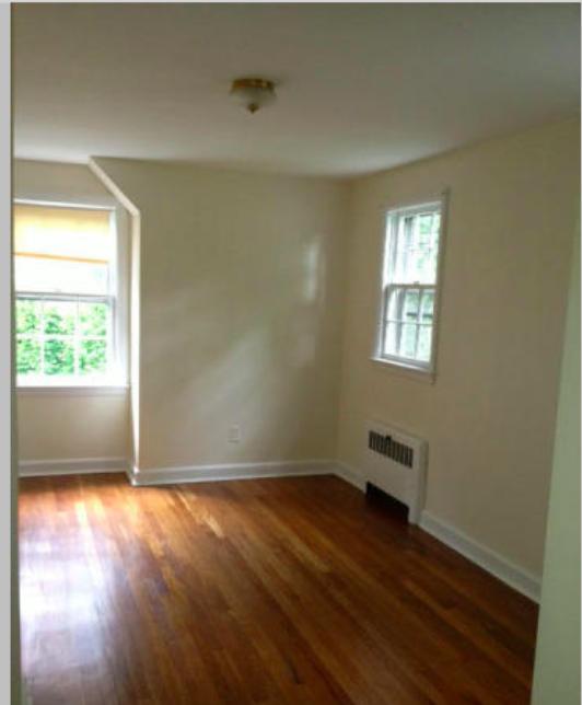 106 Woodland Road New Canaan, CT 06840 - Photo 9 of 10 a view of room with window and wooden floor