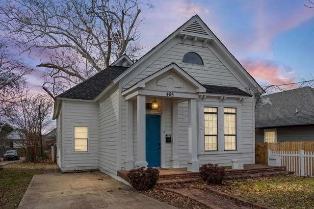 a front view of a house with a yard