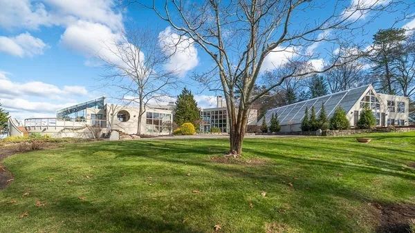 a view of a big yard next to a house