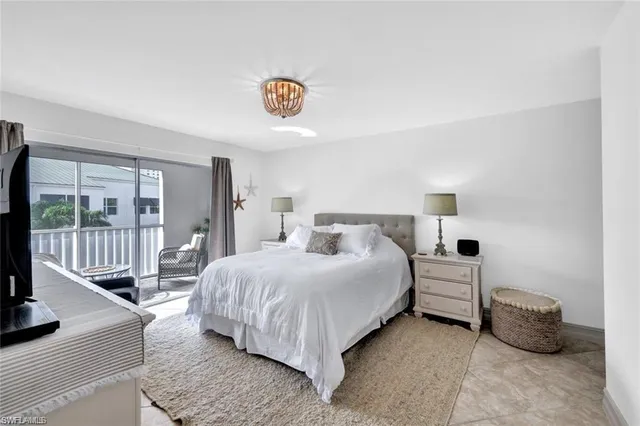 a kitchen with granite countertop a sink a stove and cabinets