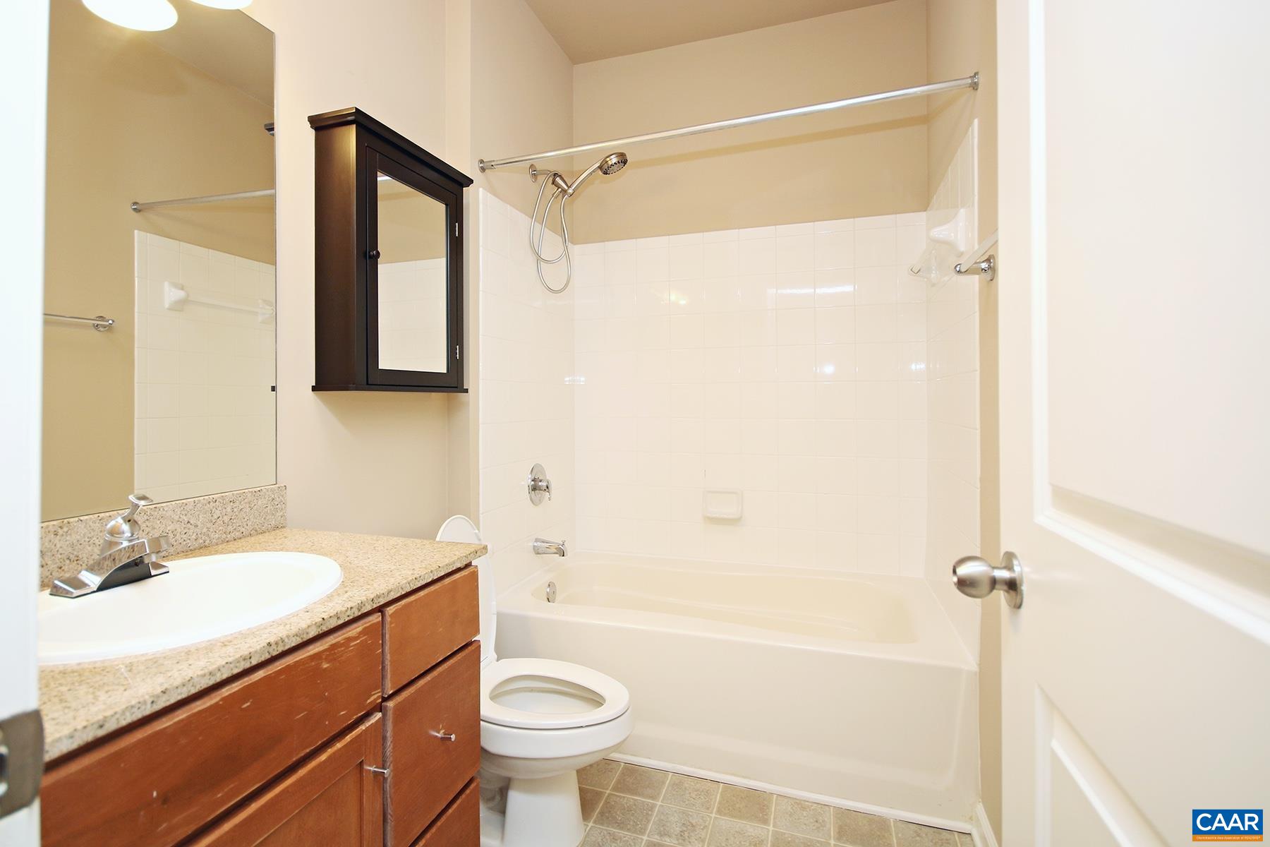 735 Walker Square, Unit 3D Charlottesville, VA 22903 - Photo 11 of 12 a bathroom with a sink a toilet and shower