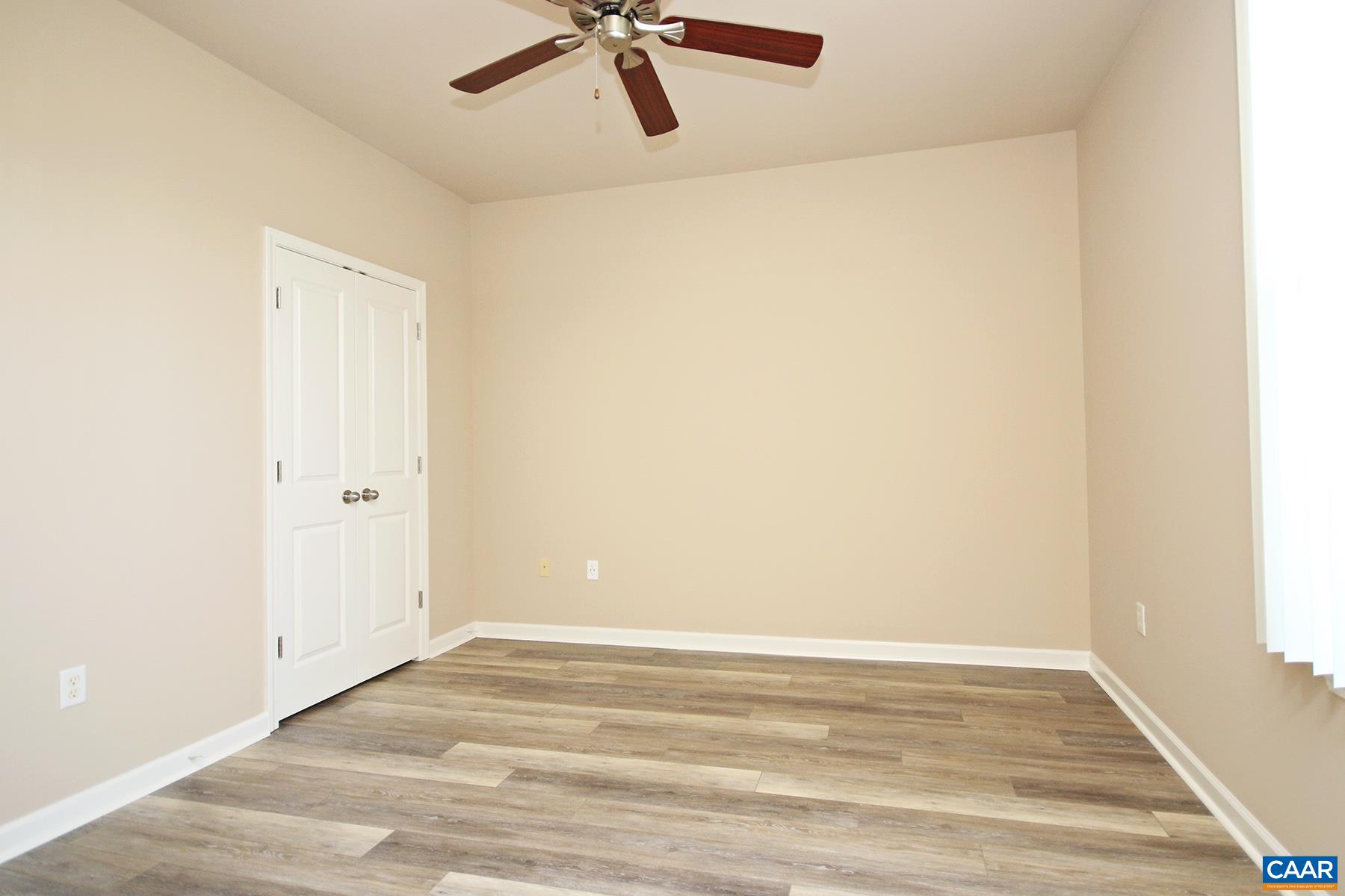 735 Walker Square, Unit 3D Charlottesville, VA 22903 - Photo 9 of 12 a view of a room with wooden floor and cabinet