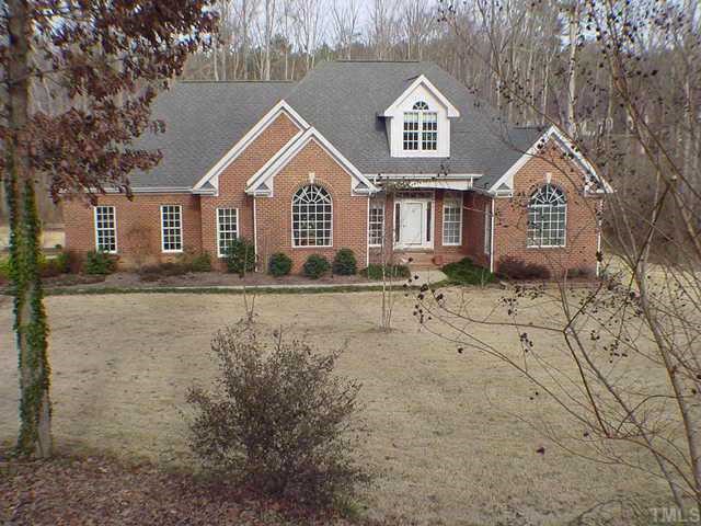 5112 Bartons Road Raleigh, NC 27613 - Photo 1 of 1 a front view of a house with a yard and garage