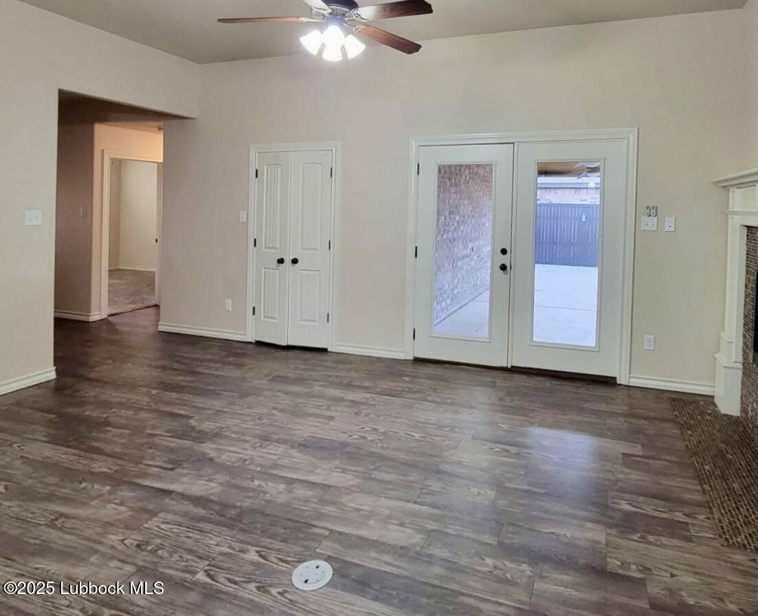 906 11th Street Wolfforth, TX 79382 - Photo 3 of 5 a view of an empty room with wooden floor