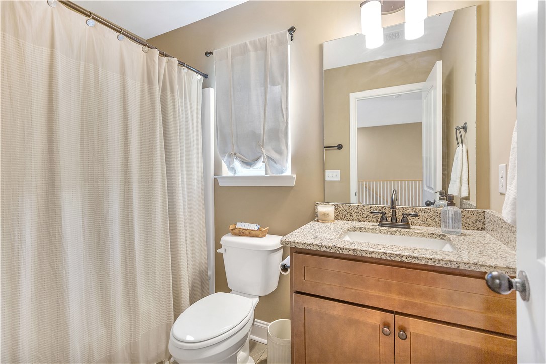 3004 Cobbs Way Anderson, SC 29621 - Photo 24 of 46 Natural stone counters pair beautifully with warm wood cabinetry in this well-appointed bathroom.