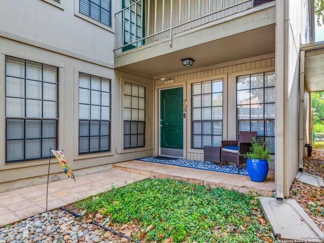 a front view of a building with garden