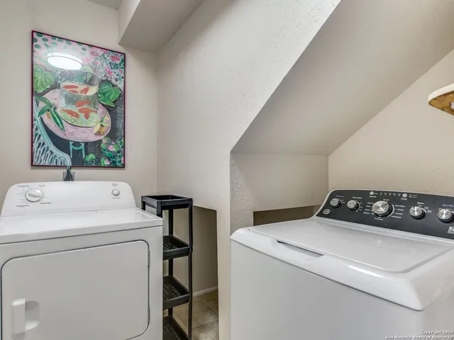 a utility room with dryer and washer