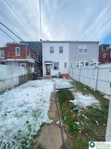 a view of a yard in front of a house