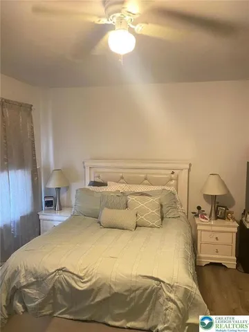 a bedroom with a bed and window