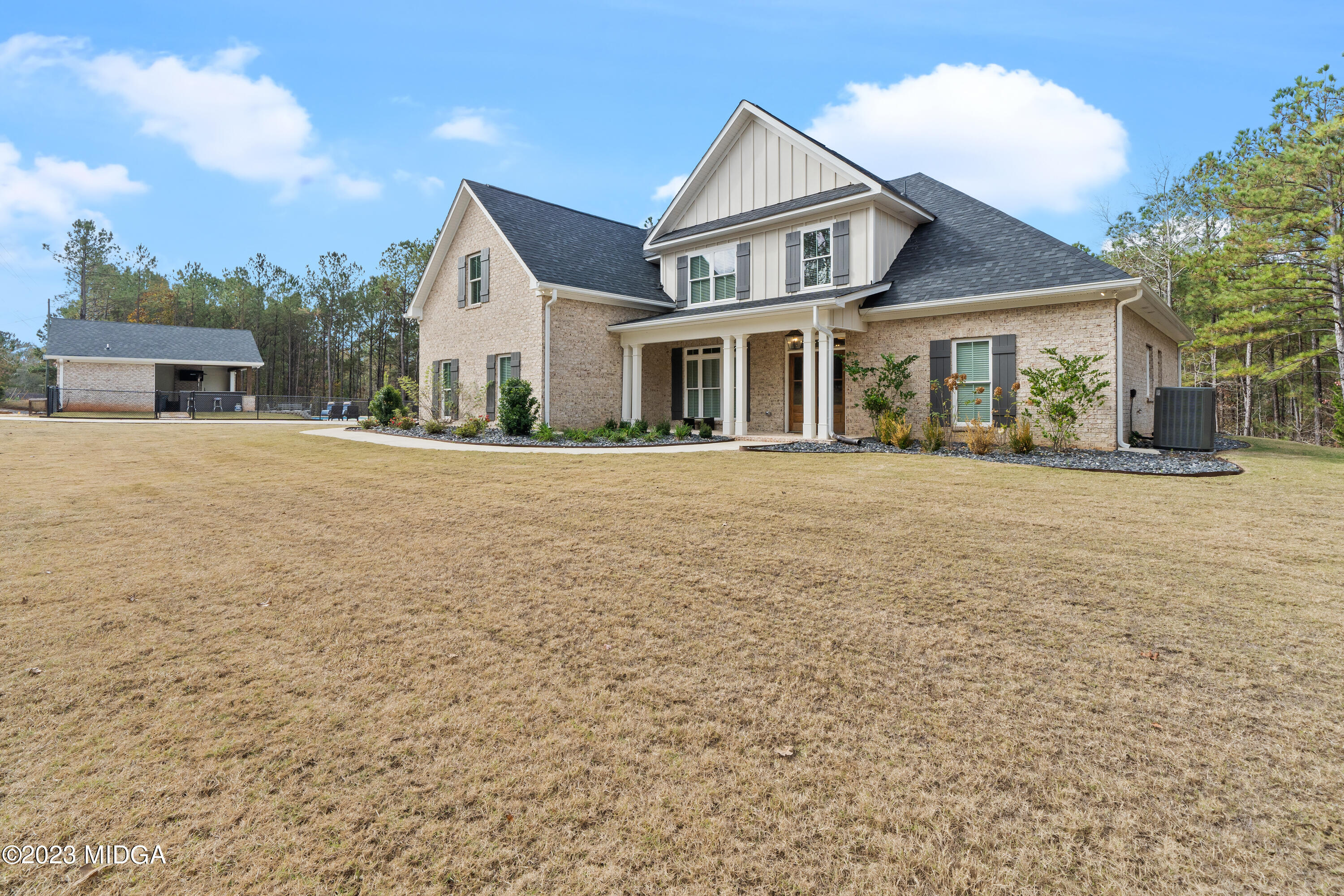 556 Pea Ridge Road Juliette, GA 31046 - Photo 1 of 42 front view of a house with a yard
