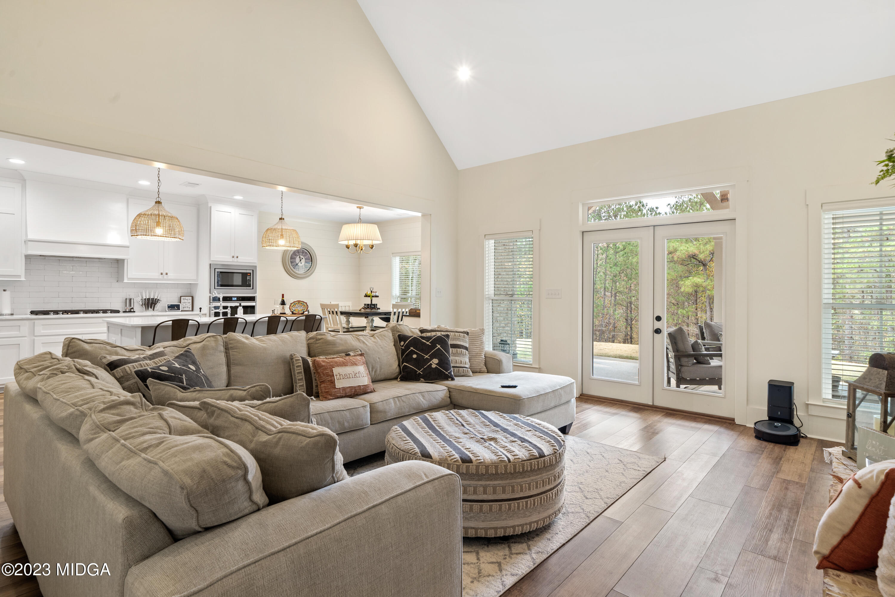 556 Pea Ridge Road Juliette, GA 31046 - Photo 11 of 42 a living room with furniture wooden floor and a large window