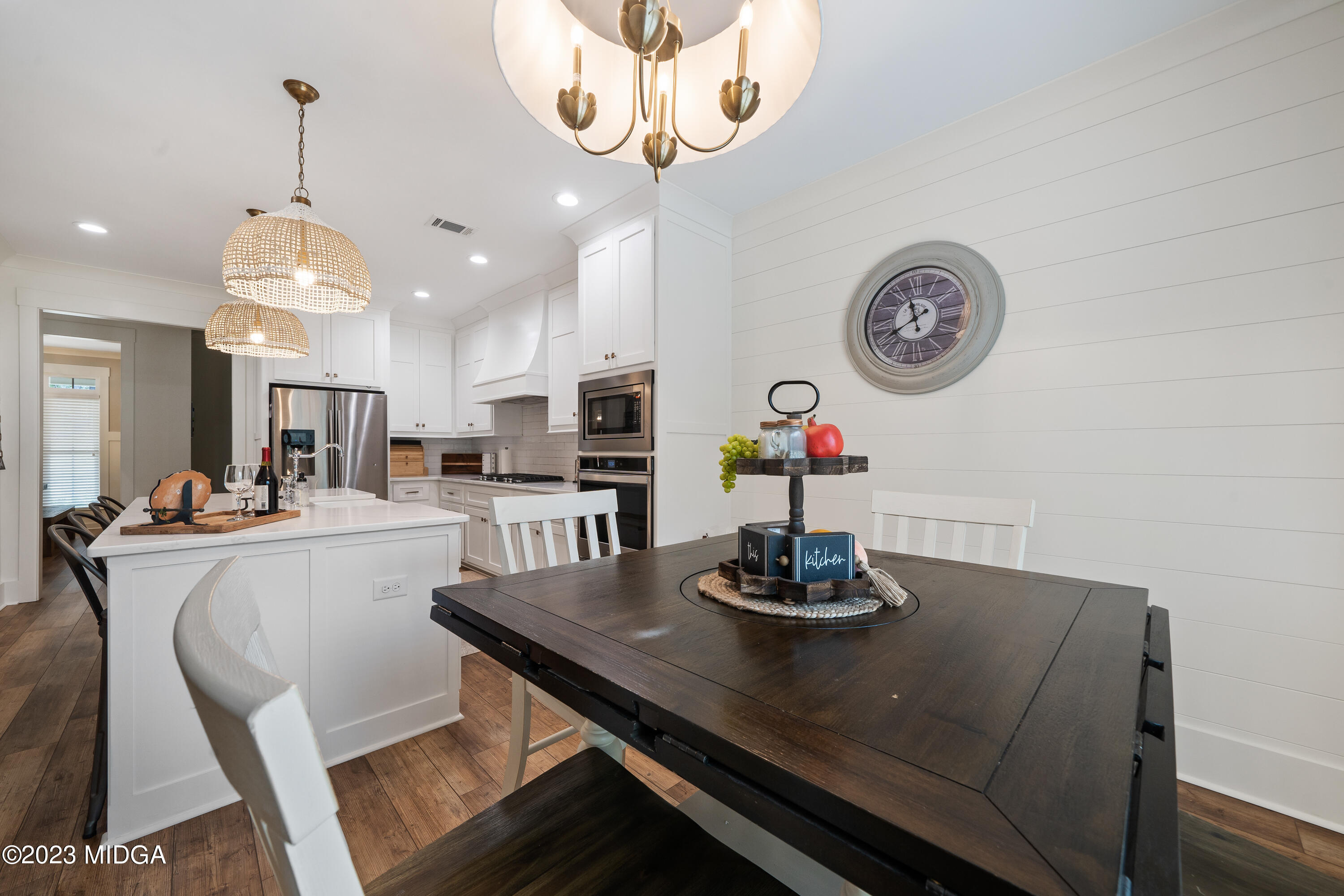 556 Pea Ridge Road Juliette, GA 31046 - Photo 15 of 42 a kitchen with a dining table and chairs