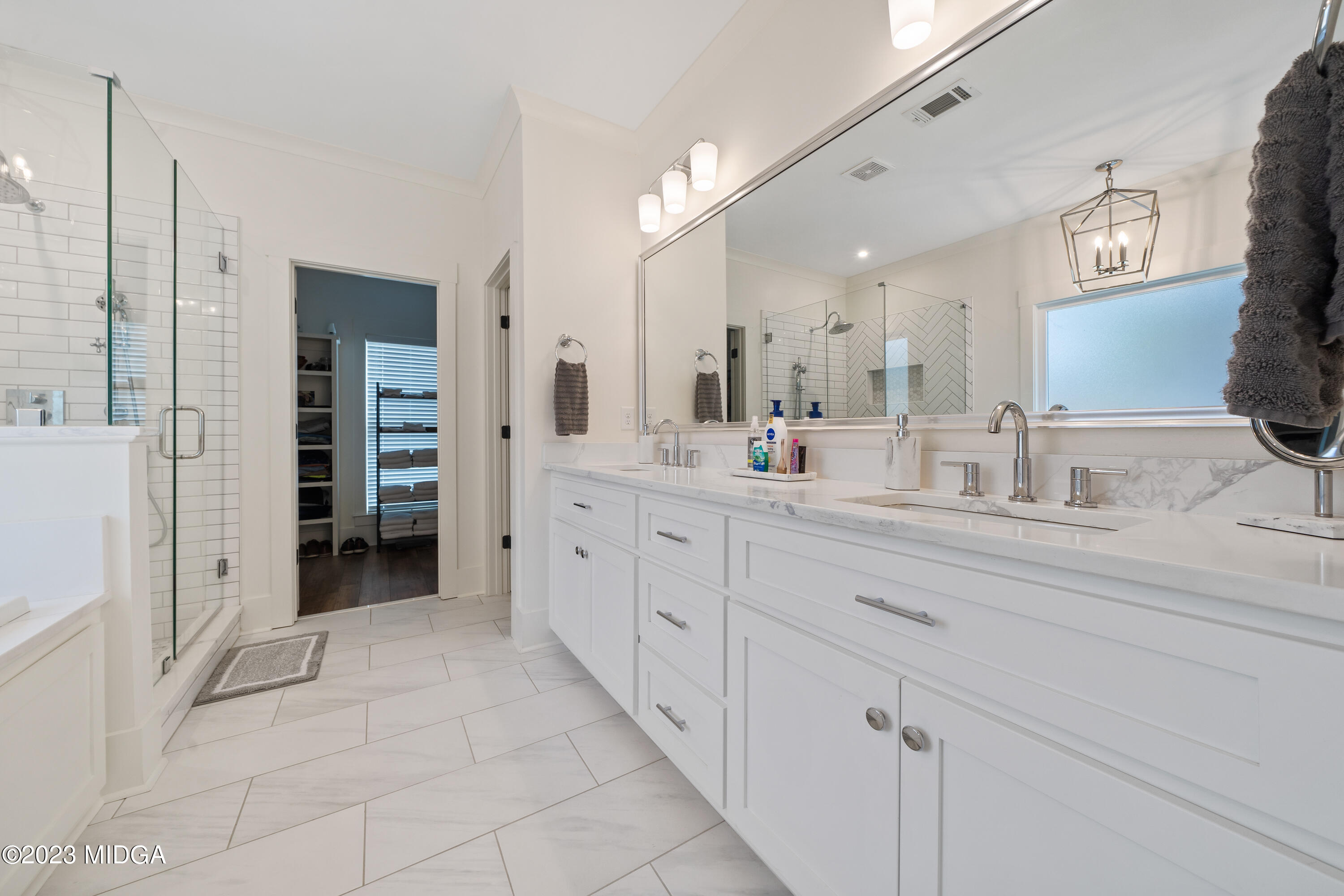 556 Pea Ridge Road Juliette, GA 31046 - Photo 17 of 42 a bathroom with a double vanity sink and a mirror