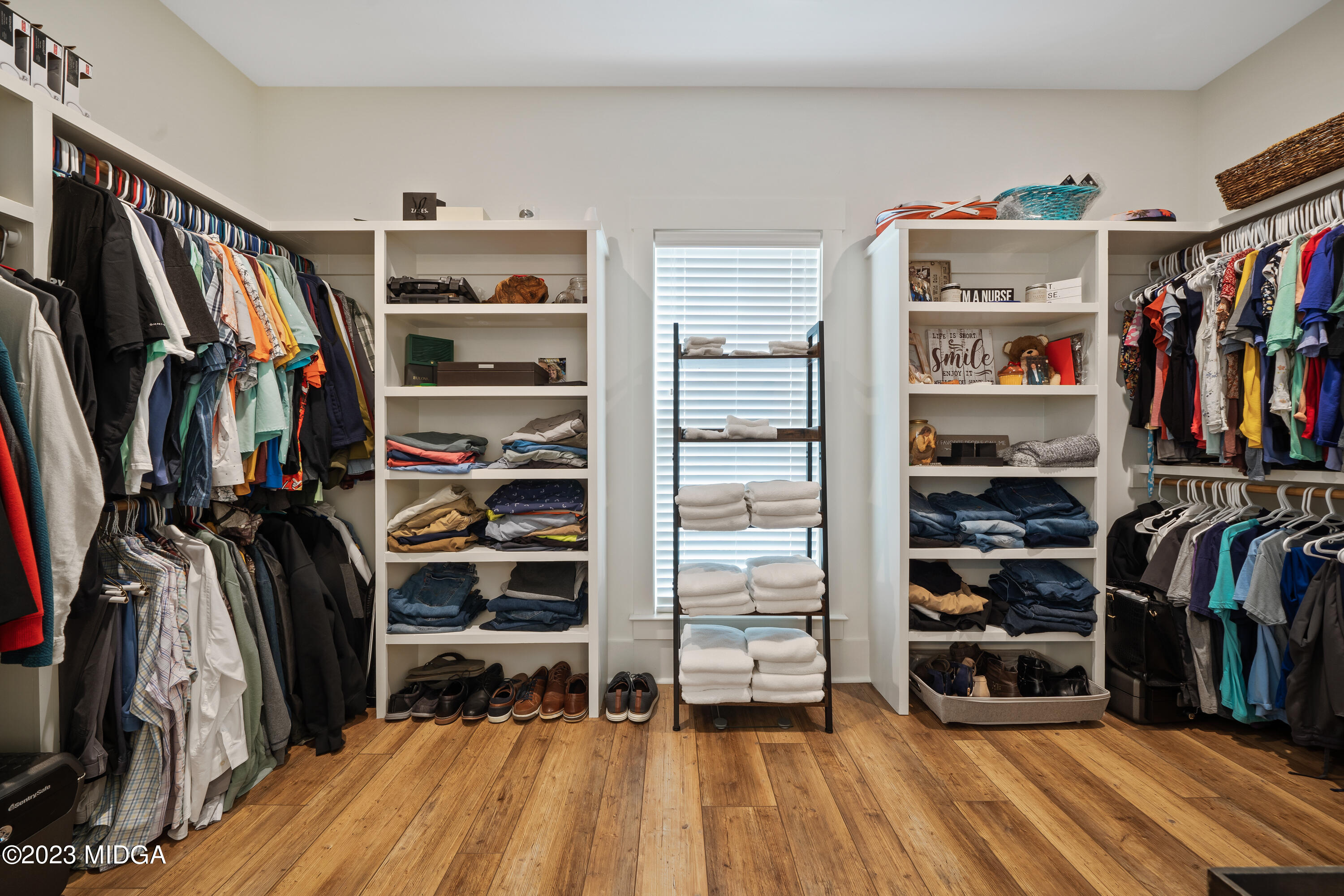 556 Pea Ridge Road Juliette, GA 31046 - Photo 19 of 42 a view of walk in closet with clothes and shoes