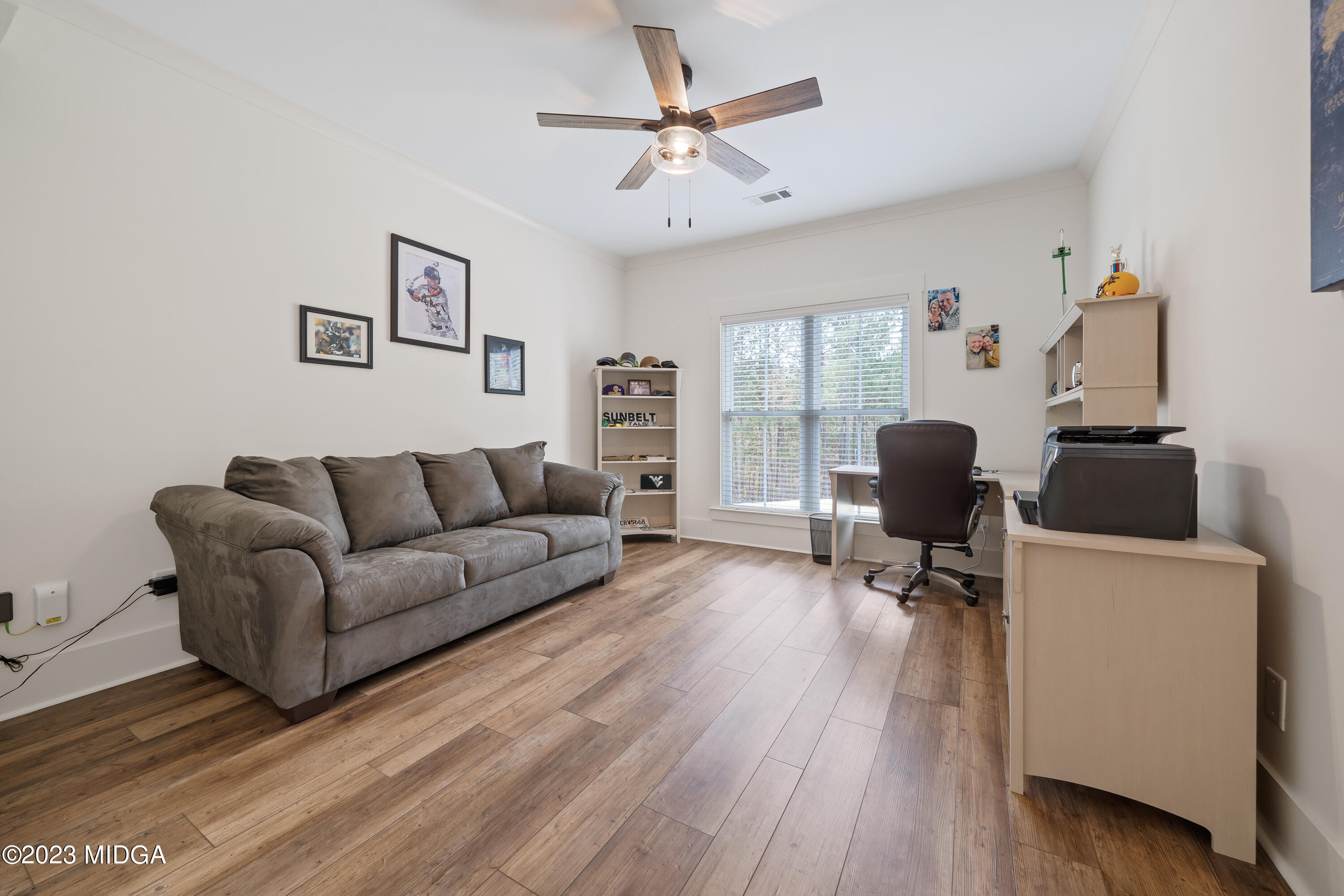 556 Pea Ridge Road Juliette, GA 31046 - Photo 20 of 42 a living room with furniture and a flat screen tv