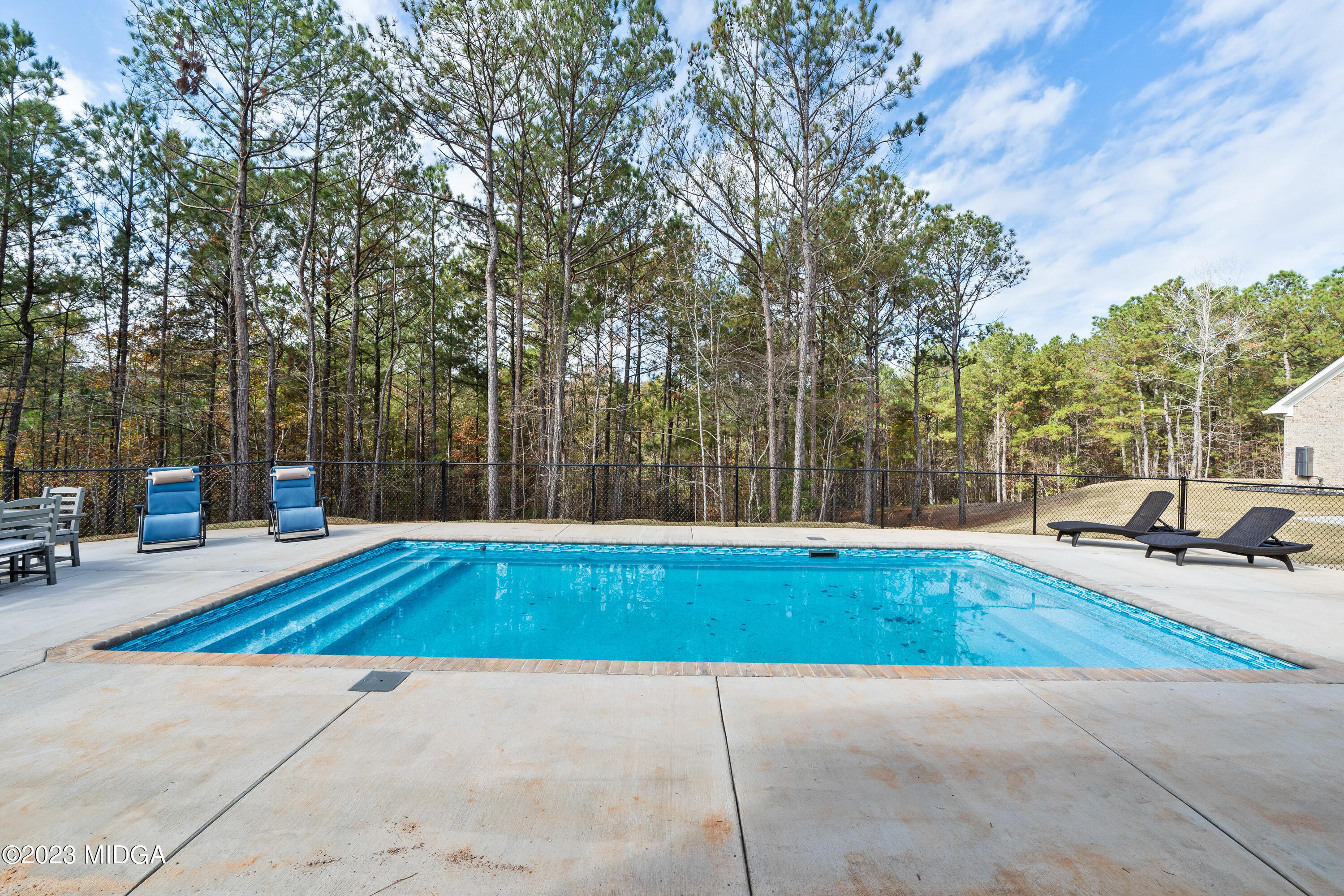 556 Pea Ridge Road Juliette, GA 31046 - Photo 2 of 42 a view of outdoor space with swimming pool and sitting area
