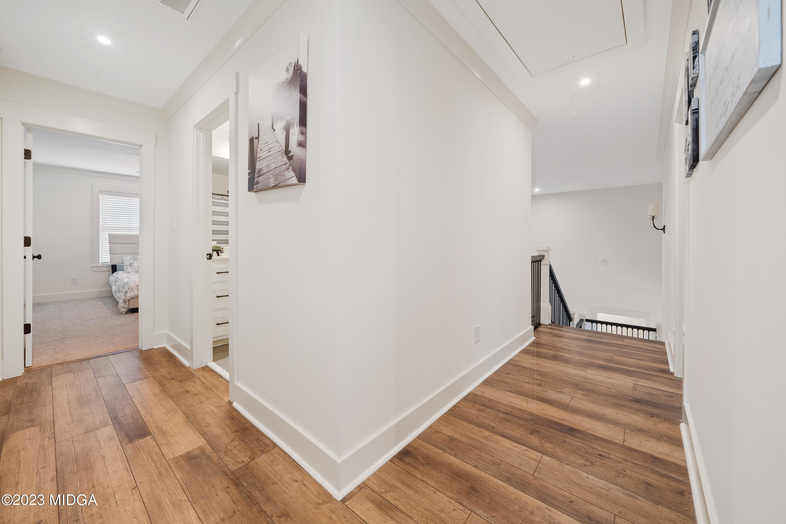 556 Pea Ridge Road Juliette, GA 31046 - Photo 22 of 42 a view of a hallway with wooden floor and staircase