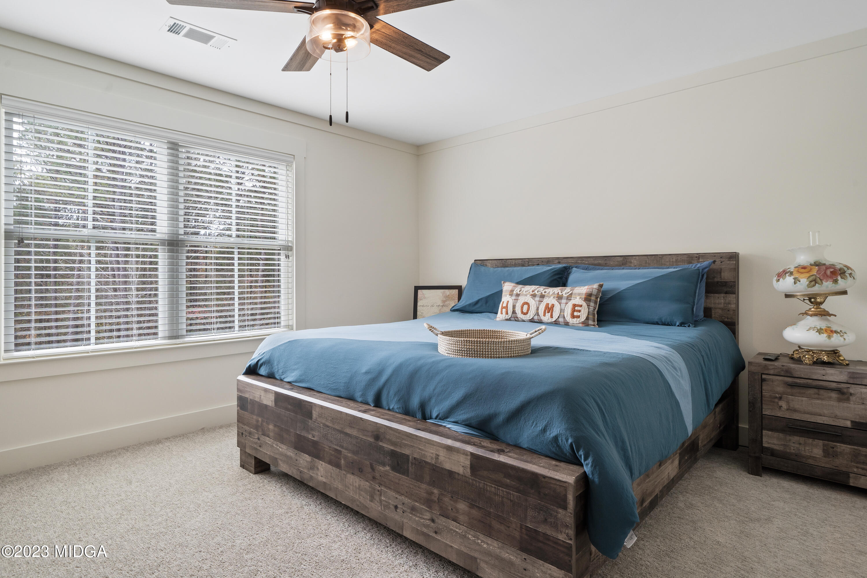 556 Pea Ridge Road Juliette, GA 31046 - Photo 26 of 42 a bedroom with a bed and window