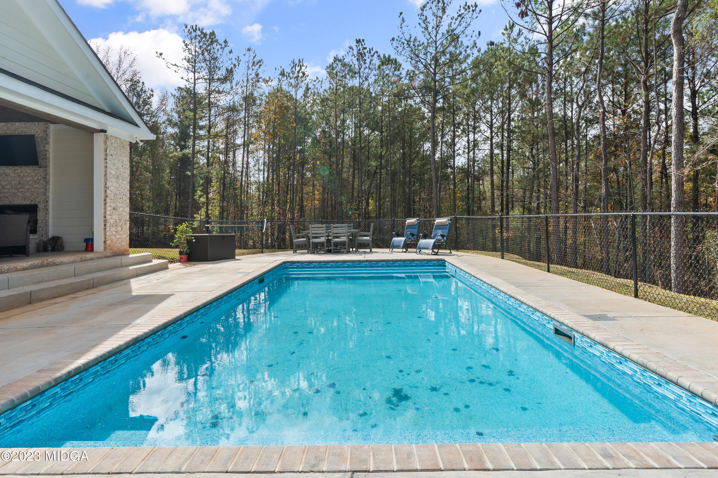 556 Pea Ridge Road Juliette, GA 31046 - Photo 31 of 42 a swimming pool with chairs